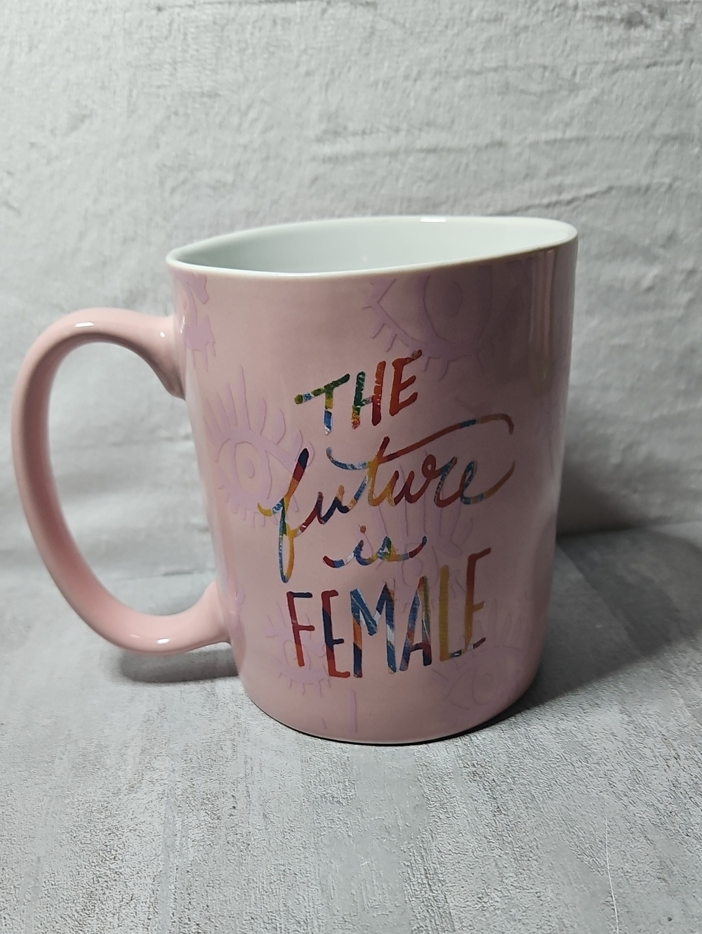 Etta Vee ceramic mug features a "The Future Is Female" graphic in a pastel pink